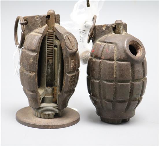 A deactivated WWII hand grenade and similar with cut out to show workings